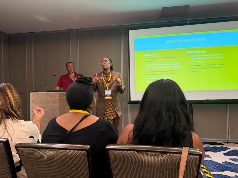 Dr. Nick presenting on Black Boy Joy